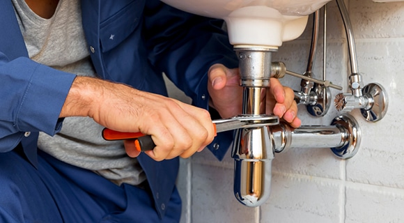 A Plumber Fixing the Sink Pipe in Bathurst, NSW