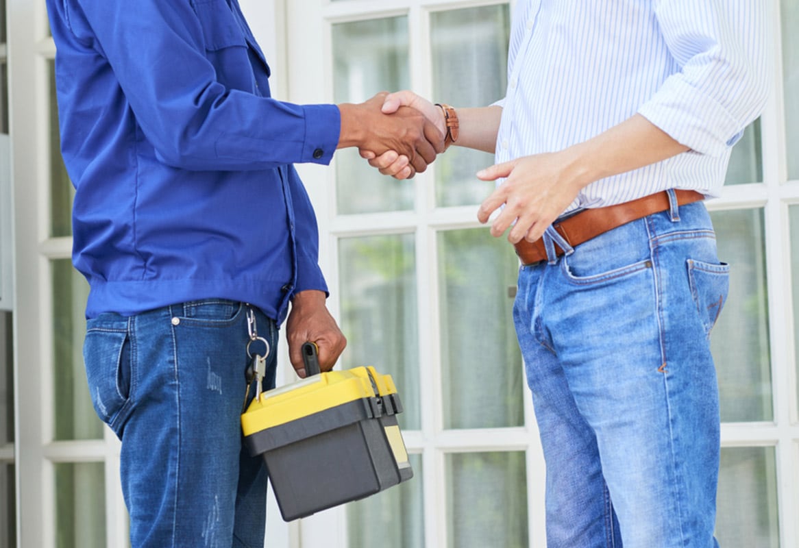 A Plumber and Client Shaking Hands - Plumbing Services In Lithgow, NSW