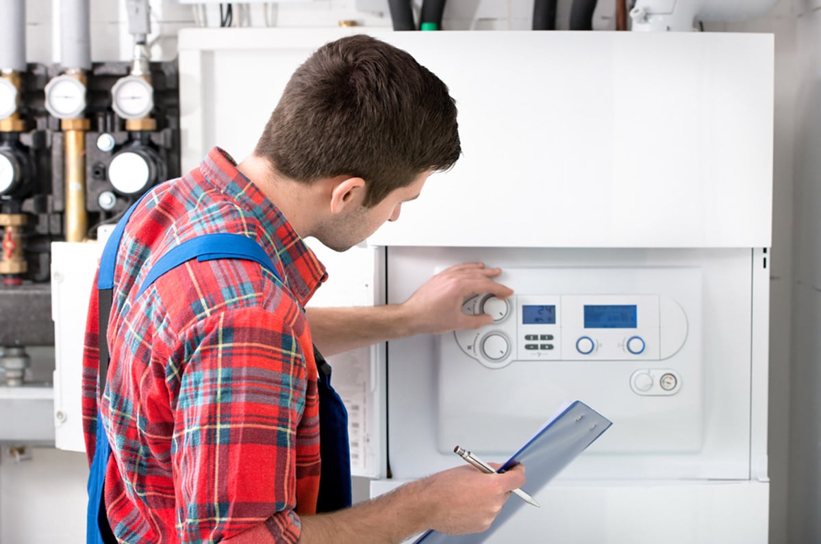 A Plumber Servicing the Gas Boiler for Hot Water and Heating in Bathurst, NSW