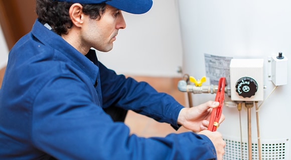 Plumber Fixing a Hot Water Heater in Bathurst, NSW