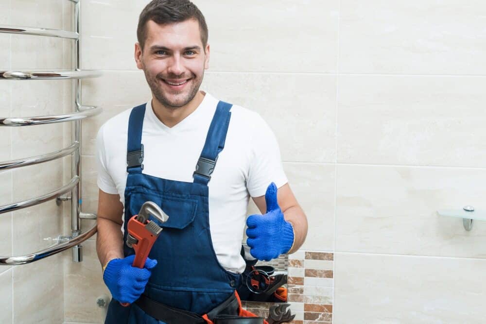 Plumber Holding a Wrench - Plumbing Services In Blayney, NSW