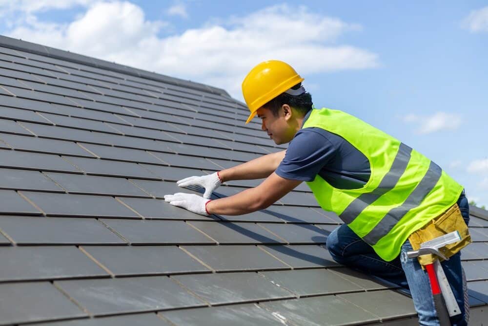 Worker Repairing Roof - Roofing and Guttering Services in Lithgow, NSW