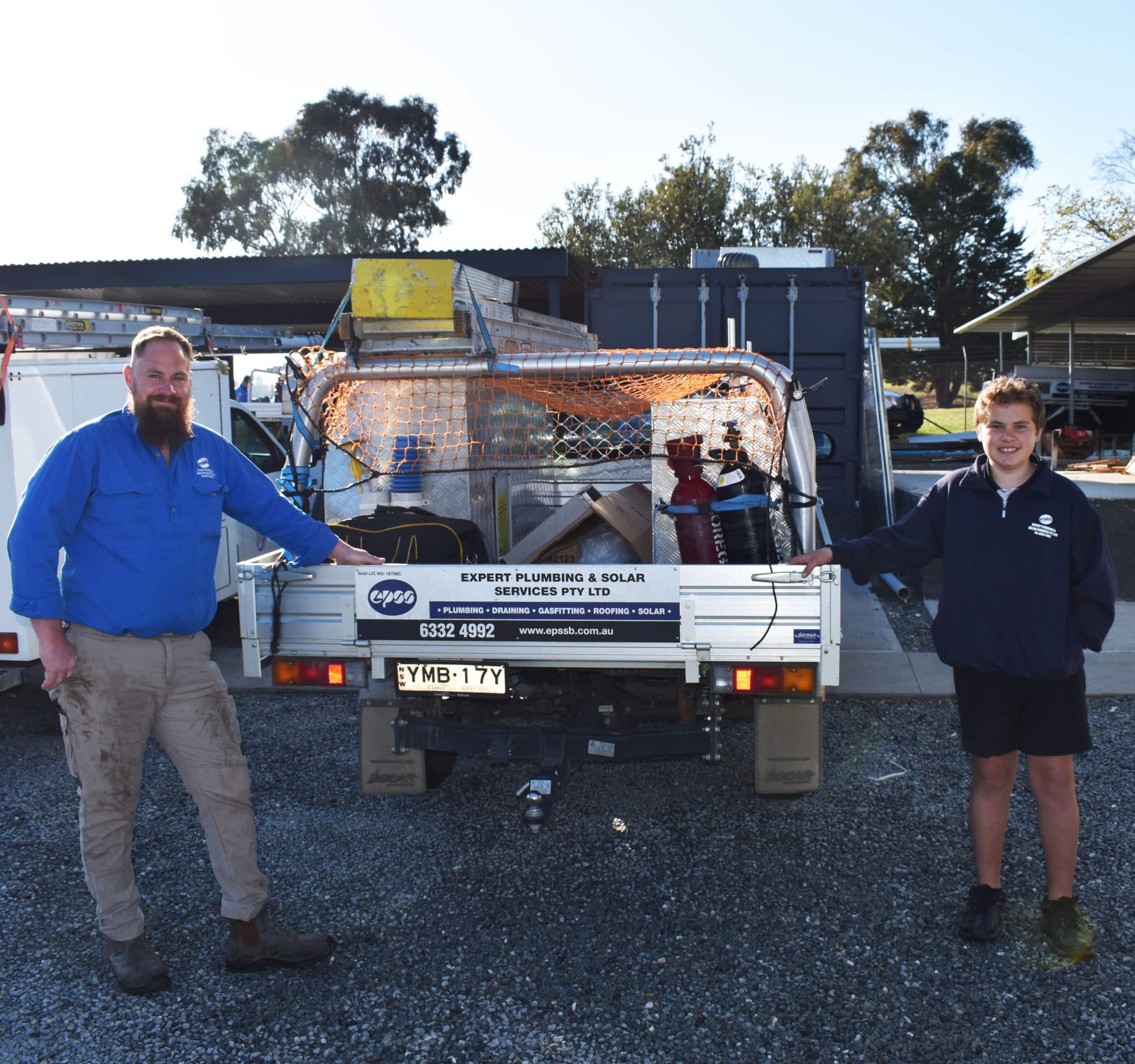 Staff Members Standing Next to the Company Vehicle - Emergency Plumbing Services In Orange, NSW