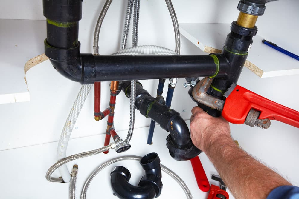 Professional Plumber With A Wrench - Plumbing Services In Orange, NSW