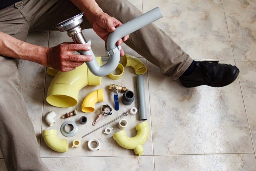 Plumber Checking Pipes - Plumbing Services In Blayney, NSW
