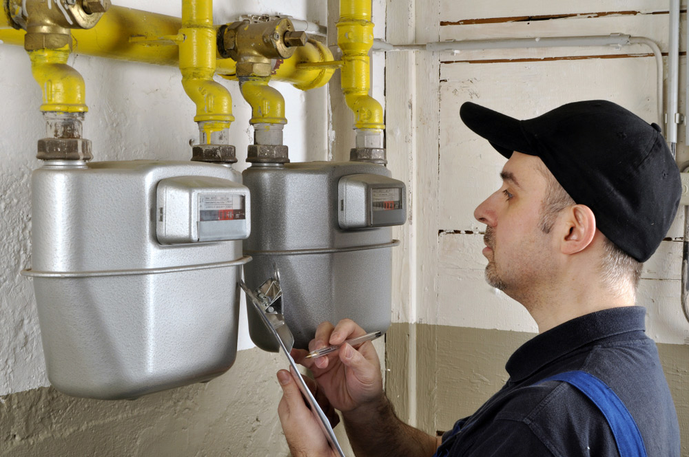 Man Checks Gas Consumption